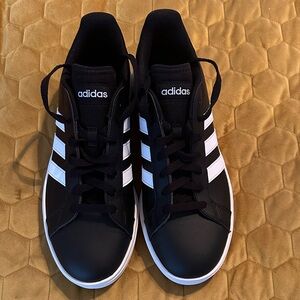 Adidas Women’s Black Sneakers with White Stripes